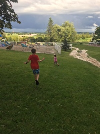 Running down the hill to the playground after a rain storm leads to..